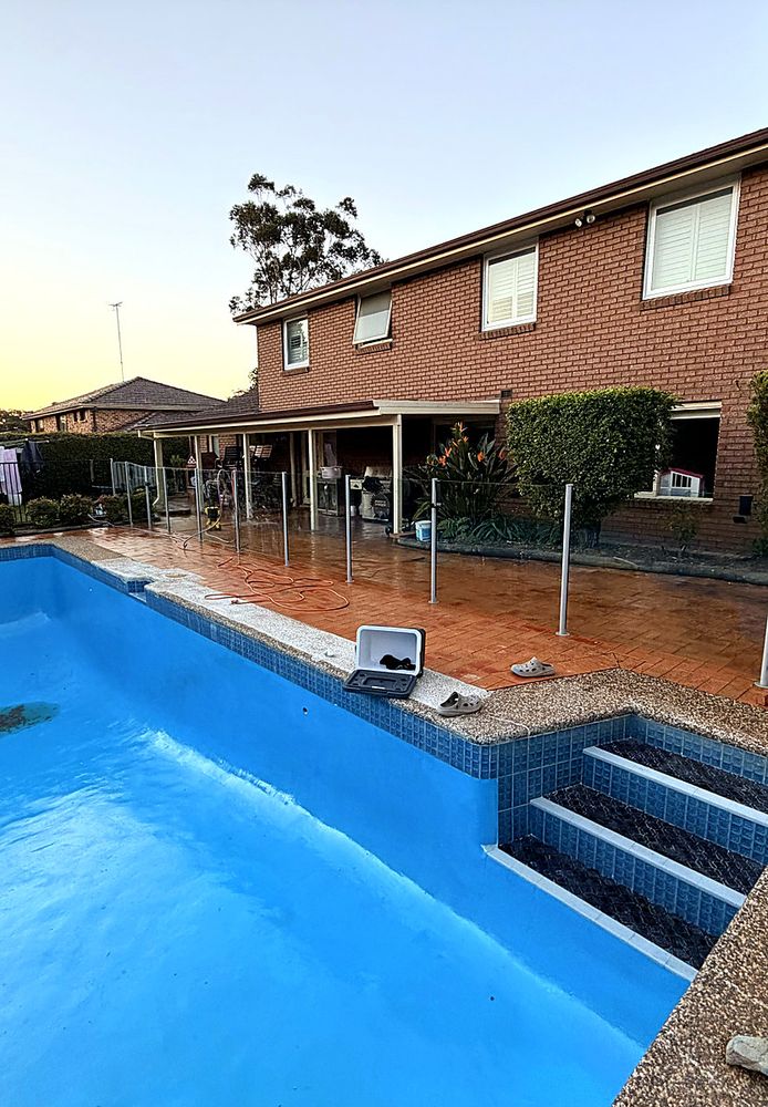 Resurfaced pool with new interior at sunset
