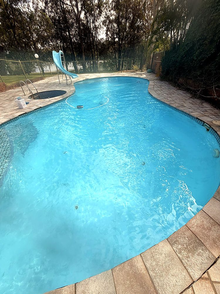 Freeform pool with slide and spa