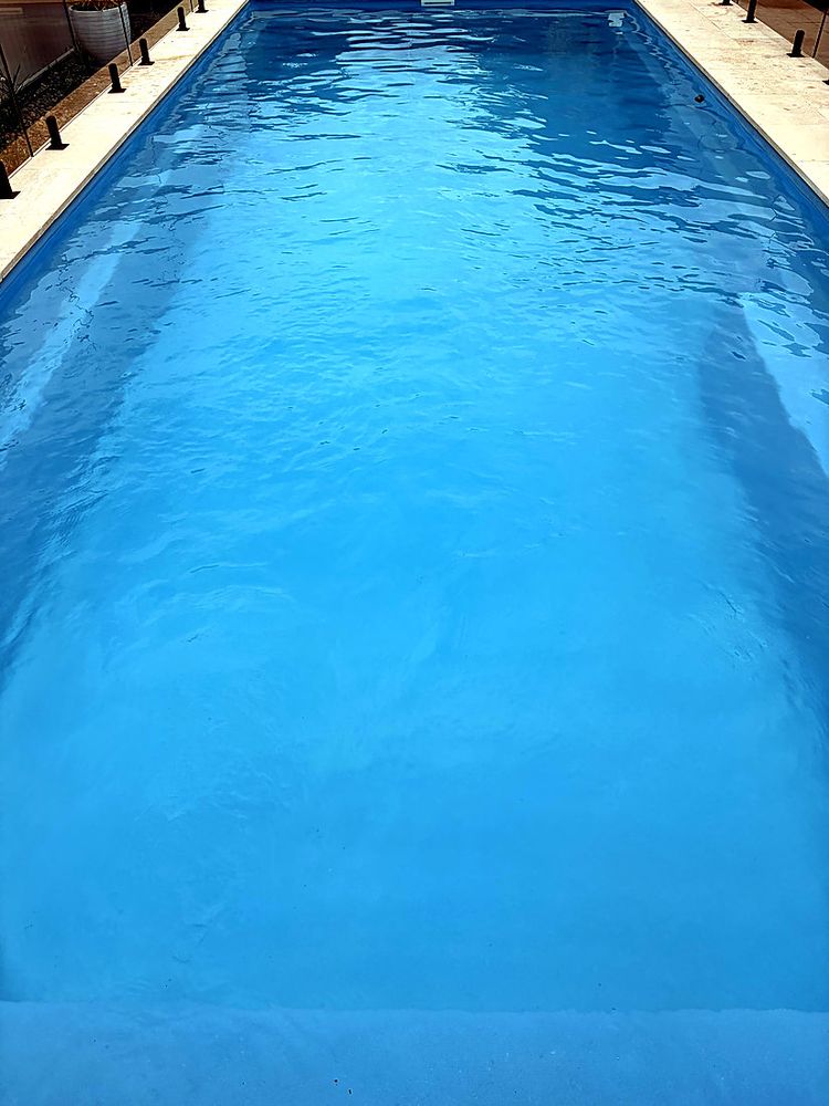 Long lap pool with light blue water